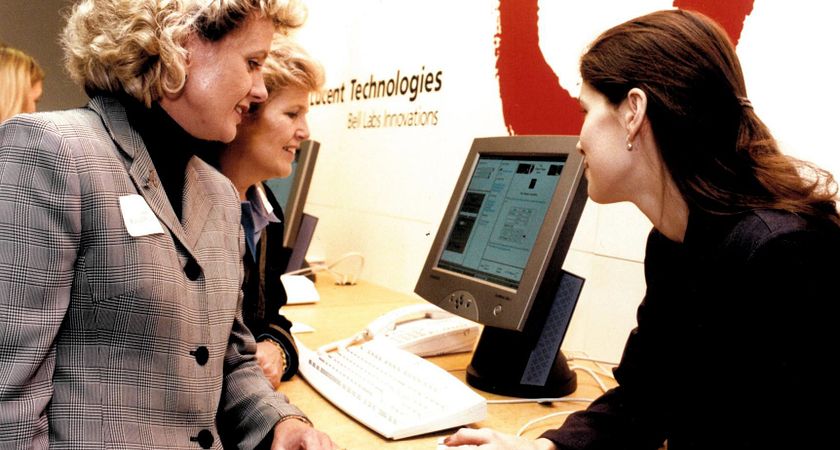 picture of Ann Buller visiting a Lucent Technologies display